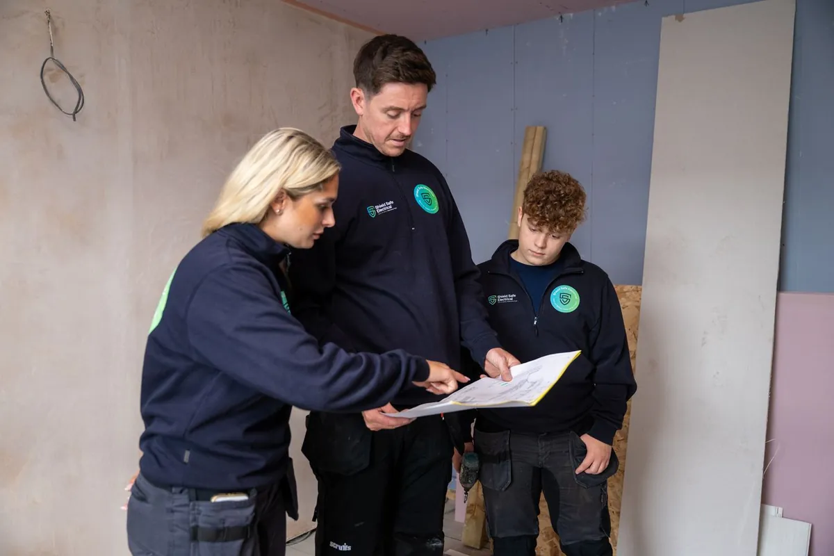 The Shield Safe Electrical team reviewing drawings on site